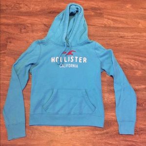 Light blue hoodie.